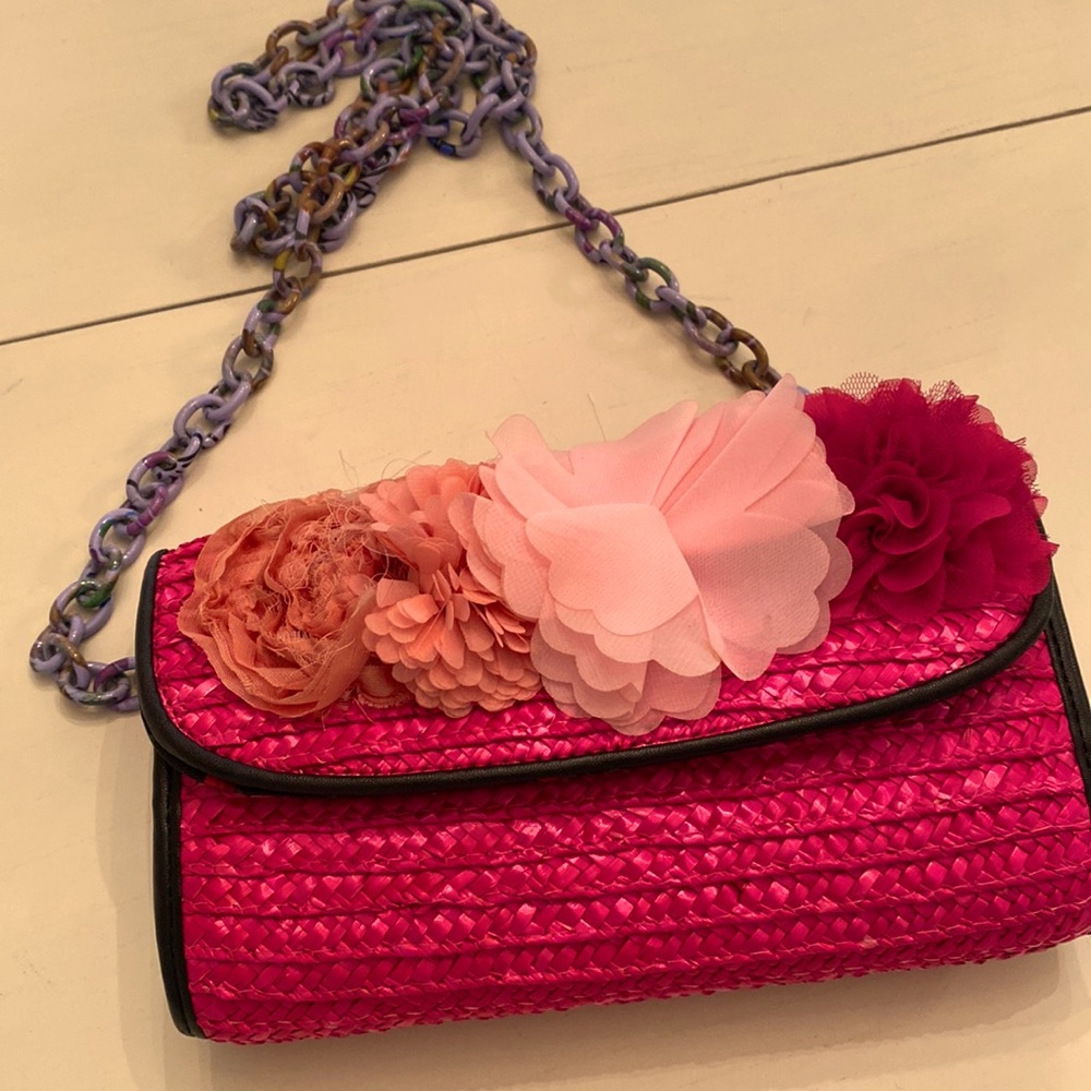 Pink straw clutch or shoulder bag.